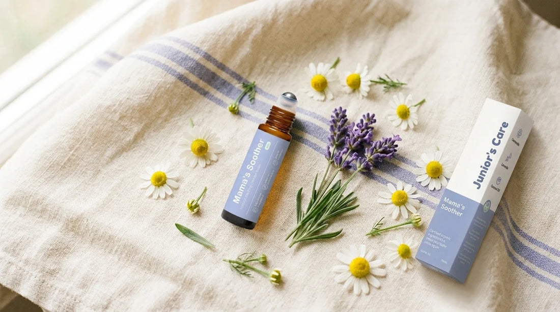 Chamomile flowers and lavender beside a small roll-on bottle.